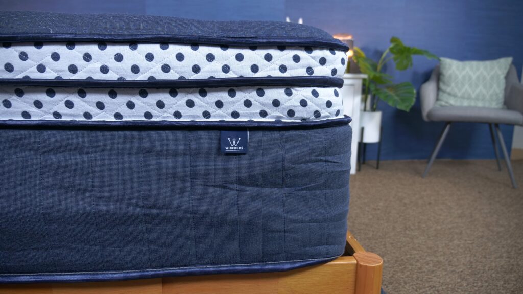 Winkbed Blue S2 Mattress corner image on display Texan Mattress Magnolia 