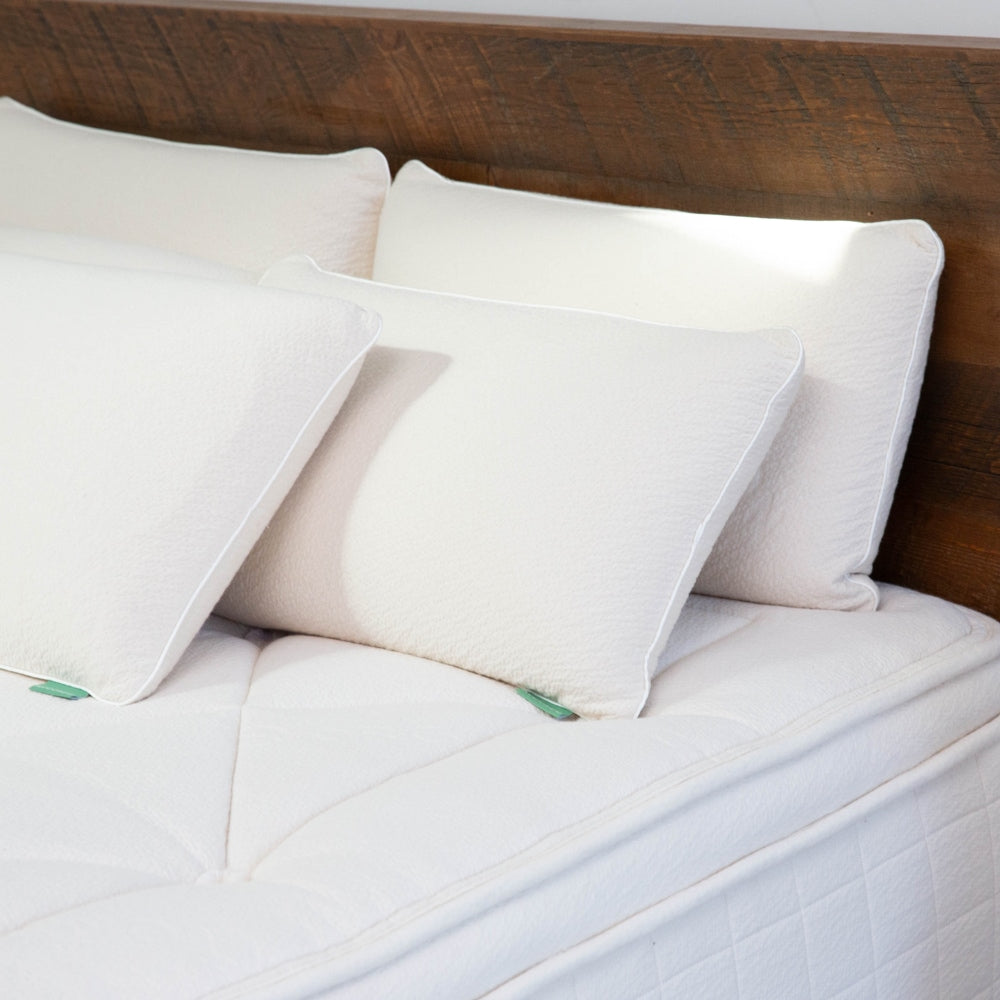 Pure Talalay Luxury Pillow on a bed