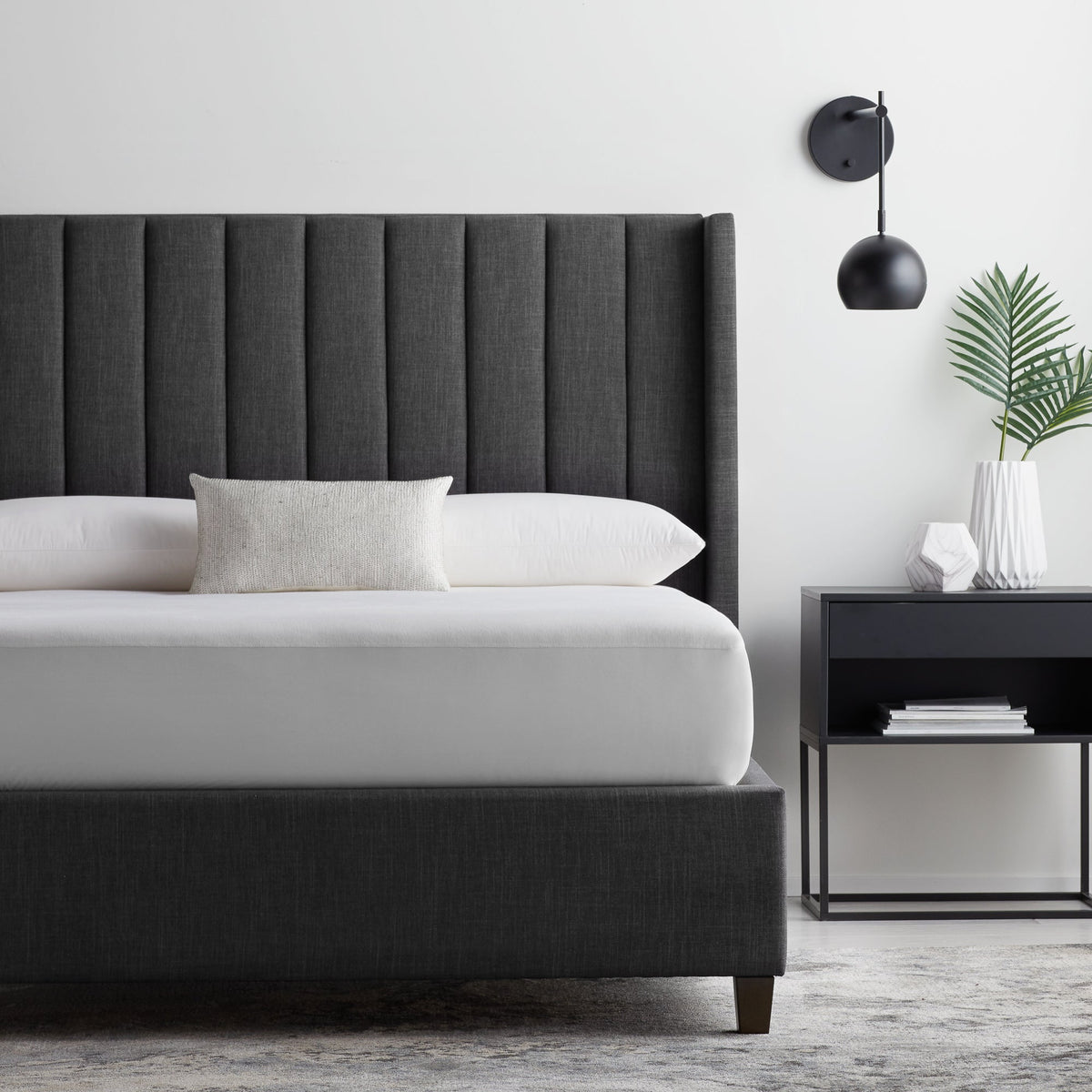 Malouf Five Sided OmniPhase mattress protector on a bed