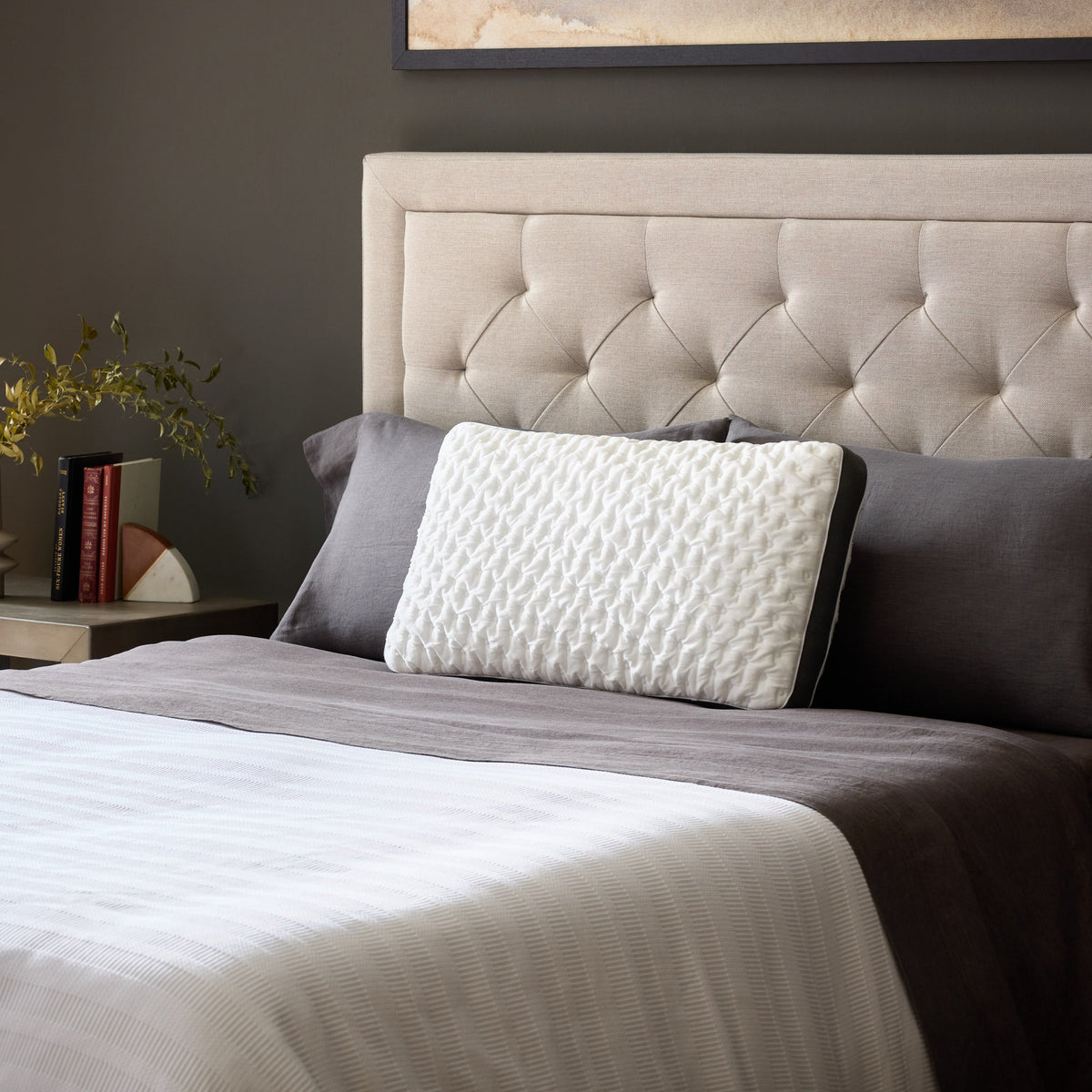 Malouf Quilted Convolution pillow on bed