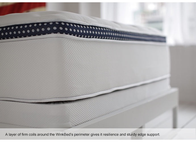 Sleeper resting on the WinkBed hybrid mattress
